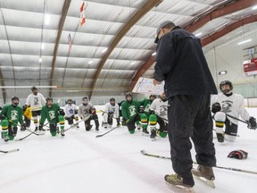Head coach Rob Crowther of the London Jr. Knights minor midget team explains a drill during practice.  (Mike Hensen/The London Free Press file photo)
