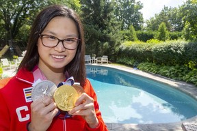 Maggie McNeill poses with her gold, silver and bronze medals in swimming at the Tokyo Olympics in front of the pool her family installed in London years ago for swimming lessons.  (File photos by Mike Hansen/London Free Press)