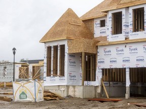 Construction continues on large homes in the Warbler Woods area near the west end of London, Ont. on Friday, Oct. 29, 2021. London leads many larger cities in per-capital housing construction, a benchmark report says. (Mike Hensen/The London Free Press)