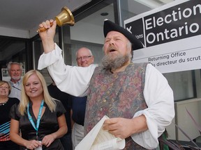Town Crier Bill Paul reads a proclamation. (File photo)
