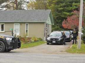 Members of the Ontario Provincial Police were stationed outside the home of Norfolk gunsmith Roger Kotanko, 70, of Port Ryerse Road west of Port Dover Thursday morning. Friends, neighbours and a witness report Kotanko was shot Wednesday as members of the Toronto Police Service executed a firearms search warrant at his home. (Monte Sonnenberg/Postmedia Network)