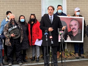 Simcoe lawyer Michael Smitiuch speaks at a news conference Thursday in front of the home of Rodger Kotanko on Port Ryerse Road near Port Dover while being flanked by members of of Kotanko's family. The family is seeking answers about Kotanko's death Nov. 3. Kotanko, a gunsmith, was shot in his shop at his home while Toronto police officers executed a search warrant. The province's Special Investigations Unit is probing his death. (Brian Thompson/Postmedia Network)