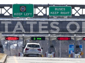A Quebec registered car heads toward the one open lane to enter the United States at the Lacolle border crossing.