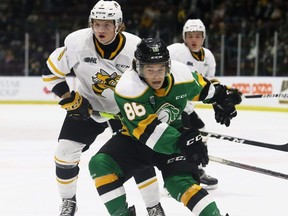London Knights' Denver Barkey (86) and Sarnia Sting's Nolan Dann (9) battle in the first period at Progressive Auto Sales Arena in Sarnia, Ont., on Saturday, Oct. 16, 2021. (Mark Malone/Postmedia Network)