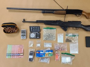 A London man, 49, faces a string of charges after London police seized firearms, cocaine, fentanyl and other drugs, shown here, following a search on Dufferin Street Thursday, police said. (Photo by London Police)