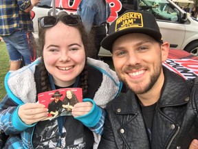 The Canadian Country Music Awards' ultimate fan is Londoner Annette Dawm, seen here with Canadian country music star Brett Kissel at 2019's ParkJam, holding a photo of herself with Kissel at the Juno Awards the same year.
