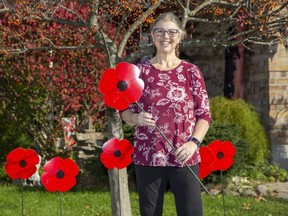 Cindy Salmon has decorated her home with lawn poppies that are being distributed by the Lions Club in London. (Derek Ruttan/The London Free Press)