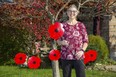 Cindy Salmon has decorated her home with lawn poppies that are being distributed by the Lions Club in London, Ont. on Friday November 5, 2021. (Derek Ruttan/The London Free Press)