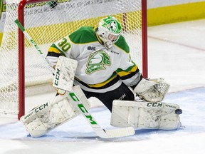 London Knights goalie Brett Brochu makes a toe save during a game against the Owen Sound Attack at Budweiser Gardens in London on Friday Nov. 5, 2021. Brochu has started all 14 games so far this season but could get a break this weekend when the Knights play three games in three days. (Derek Ruttan/The London Free Press)