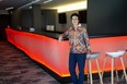 The Grand Theatre's executive director Deb Harvey leans up against the bar in the newly renovated Drewlo Lounge in on Nov. 12, 2021. (Derek Ruttan/The London Free Press)