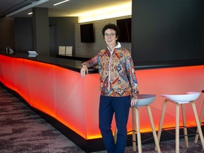 The Grand Theatre's executive director Deb Harvey leans up against the bar in the newly renovated Drewlo Lounge in on Nov. 12, 2021. (Derek Ruttan/The London Free Press)