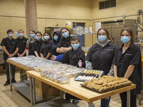 Grade 10 students from Neil McMillan's culinary class have been working hard to replenish baked goods that were stolen and or damaged during a break-in at B. Davison Secondary School in London. Thieves stole or destroyed $10,000 worth of goods, many of which were destined for 150 Christmas hampers. Photo shot on Thursday November 18, 2021. (Derek Ruttan/The London Free Press)