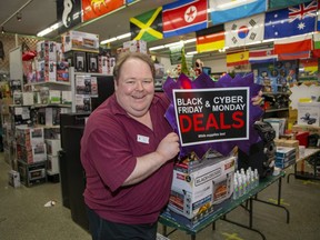 Forest City Surplus marketing director Tim Hodges is all set for Black Friday and Cyber Monday. (Derek Ruttan/The London Free Press)