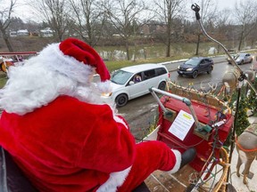 Santa Claus, played by Kevin Kernohan, was the last stop for motorists as they drove through Pinafore Park to see the annual St. Thomas Optimist Santa Claus drive-through parade in 2020. This year's parade will be a drive-through event as well. (Mike Hensen/The London Free Press)