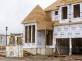 Construction continues on large homes in various stages of construction in the Warbler Woods area near the west end of London. (Mike Hensen/The London Free Press)