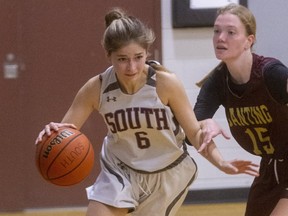 Andrea Lehkyi of South collegiate institute tries to go baseline around Emily Forsythe of Banting secondary school in a game Tuesday Nov. 9, 2021, at South. South won 48-47 to stay undefeated in tier 2 of TVDSB Central senior girls basketball. 
(Mike Hensen/The London Free Press)