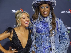 Lindsay Ell, left, and Priyanka, co-hosts of the Canadian Country Music Association Awards, pose for fans on the red carpet at Budweiser Gardens  in London on Monday, Nov. 29, 2021. (Mike Hensen/The London Free Press)