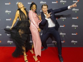 Sacha, middle, and the Reklaws celebrate their hit song What The Truck on the red carpet at the Canadian Country Music Association Awards on Monday Nov. 29, 2021, at Budweiser Gardens in London.