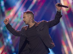 Dallas Smith won entertainer of the year, male artist of the year and and single of the year at the Canadian Country Music Association awards at Budweiser Gardens in London on Monday Nov. 29, 2021. Smith was one of several artists who performed at the show that capped off Country Music Week. Mike Hensen/The London Free Press/Postmedia Network