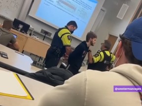 This screengrab is taken from a video showing a Western University student being arrested in class for violating the school's COVID-19 vaccine policy. He identified himself to The Free Press as Harry Wade. (Instagram/ Western Savages)
