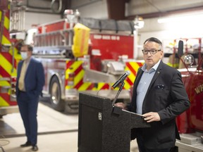 Greg Rickford, Ontario's minister of Northern Development, Mines, Natural Resources and Forestry, with Chatham-Kent Mayor Darrin Canniff, left, announced $3.8 million in funding Wednesday for people affected by the August gas explosion in Wheatley.