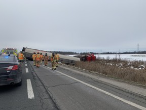 A tanker travelling west on Highway 402 rolled over Wednesday afternoon near Colonel Talbot Road. The westbound lanes at Colonel Talbot are closed while crews clean up fuel that leaked from tanker. (London fire department Twitter photo)