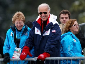 U.S. President Joe Biden won't need his Vancouver Olympic mitts he wore as vice-president in 2010 after announcing a diplomatic boycott of the Beijing Games. But the manoeuvre won't amount to much, two academics argue. (Lars Baron/Bongarts/Getty Images)