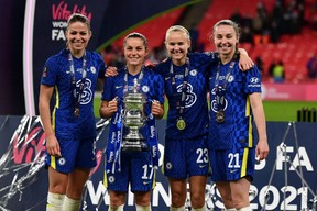 Midfielder Jessie Fleming of London, Ont., second left, celebrates Chelsea's 3-0 win over Arsenal in the 2021 Women's FA Cup final with teammates Melanie Leupolz, left, Pernille Harder and Niamh Charles at Wembley Stadium in London Dec. 5. (Ben Stanshall/Getty Images)