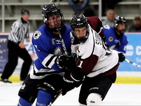 Adrian Stubberfield of the Chatham Maroons battles Jacob Chantler of the London Nationals in the third period at Chatham Memorial Arena in Chatham on Sept. 15, 2019.  Due to high COVID-19 case counts, particularly the Omicron variant, in London, the Maroons opted not to come to London Wednesday to face the Nationals, forfeiting the game. (Mark Malone/Chatham Daily News)