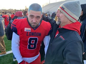 London Beefeaters head coach Gavin Lake consoles All-Canadian linebacker Codey McRoberts after their 37-0 loss to the Langley Rams in the Canadian Junior Football League championship game Saturday Dec. 4, 2021 at Western Alumni Stadium. Paul Vanderhoeven/The London Free Press