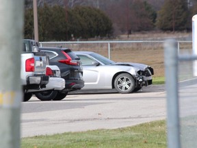 A car that was involved in a police pursuit that started in Woodstock and ended in Elgin County is seen in the parking lot of the OPP detachment on John Wise Line Friday. DALE CARRUTHERS / THE LONDON FREE PRESS