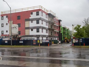 Two workers died and five were injured when part of the Nest on Wonderland building at 555 Teeple Terrace in London collapsed Dec. 11, 2020. The Labour Ministry announced charges Monday under the Occupational Health and Safety Act against two companies and an unnamed individual.  (Derek Ruttan/The London Free Press)