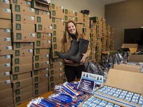 Mary Johnson, vice-president of StreetCity Realty and founder of Kindness Above Everything, and her co-workers, will create 200 winter survival kits and deliver them to London Cares Homeless Response Services. (Derek Ruttan/The London Free Press)