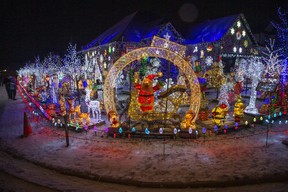 Thousands of lights adorn the home of Jeff  Vanleeuwen at 220 Songbird Lane Ilderton on Thursday December 9, 2021. The impressive display is in support of three charities; Childcan, the Ailsa Craig and Area Food Bank, and St. Joseph's Health Foundation.  (Derek Ruttan/The London Free Press)