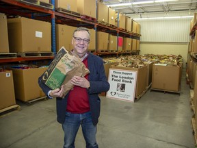 Wayne Dunn, campaign chairperson of the Business Cares Food Drive, says food pickups and deliveries have been “really good” since the campaign launched earlier this month, but more cash donations are needed. Donated food is being delivered Dec. 22 to the London Food Bank. (Derek Ruttan/The London Free Press)