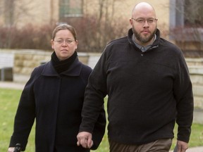 Herbert Hildebrandt walks into the Elgin County courthouse in St. Thomas with his wife before the start of his trial on a charge of obstructing a police officer. The charge was laid when police showed up a service at the Church of God in Aylmer on Dec. 27, 2020, to investigate if the limit in place then for outdoor gatherings was being exceeded. Photograph taken Friday Dec. 10, 2021. (Mike Hensen/The London Free Press)