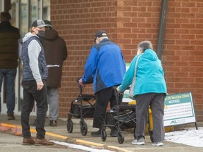 The mass COVID-19 vaccination clinic t the Caradoc Community Centre in Mt. Brydges had a short lineup extending outside on Tuesday as daily case counts continue to rise in Middlesex-London. (Mike Hensen/The London Free Press)