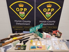 OPP officers seized large quantities of suspected fentanyl, methamphetamine and other illegal drugs along with a rifle and four imitation handguns in a search Tuesday of a home in Dashwood. The drugs are valued at $110,000, police said. (OPP photo)