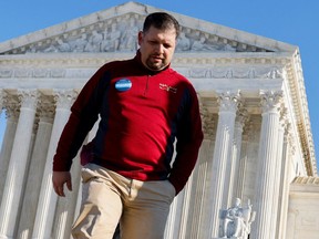 Grocery chain owner Brandon Trosclair departs the U.S. Supreme Court building in January after it heard arguments on his case against the Biden administration's nationwide vaccine-or-testing COVID-19 mandates. The court barred the mandates for businesses but allowed them for health workers.  (Jonathan Ernst/Reuters)