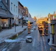 Members of the North Perth Fire Department can be seen in downtown Listowel after a transport truck collided with a building on Friday Jan. 21, 2022. (OPP photo)