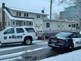 Sarnia police vehicles, including a command centre, line Watson Street near London Road as criminal and forensic officers investigate a death in late December 2021. A second death investigation is underway in Enniskillen Township where human remains were found on Crooked Line. (Paul Morden/Postmedia Network)