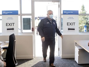 Ontario Premier Doug Ford arrives at a vaccine clinic for Purolator employees and their families at the company's plant in Toronto, Friday, Jan. 7, 2022.