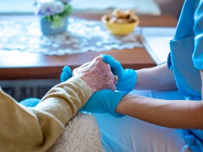 A senior receives care at home.