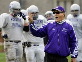 Larry Haylor, shown during practice in this London Free Press file photo from September 2006, coached the Western Mustang football team for 22 years. He died Thursday, two days after the death of Darwin Semotiuk, whom Haylor took over from in 1984. Derek Ruttan/The London Free Press