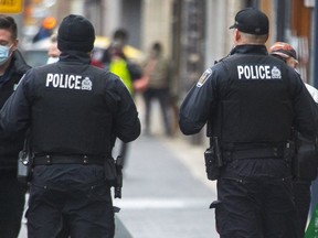 London's police chief has told a group representing downtown businesses that dismantling the downtown foot patrol, shown in a photo from December, would be a last resort as the force looks to bolster front-line patrols. (Derek Ruttan/The London Free Press)