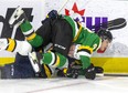 Landon Sim of the London Knights body checks Artyom Kulakov of the Erie Otters into the boards during the first period of their OHL hockey game at Budweiser Gardens in London on Friday January 21, 2022. Derek Ruttan/The London Free Press