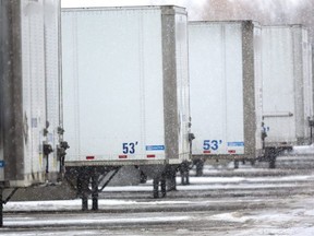 Parked tractor trailers, like these in London, are at risk of cargo theft, says the head of a company that specializes in cargo theft prevention and recovery after police reported the theft of four trucks and seven containers in Woodstock and St. Thomas last month. (Mike Hensen/The London Free Press)