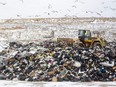 A trash compactor moves garbage at the City of London landfill site on Manning Drive Thursday, Jan. 6, 2022. The site is running out of capacity sooner than expected, while provincial approval of an expansion will take longer.  (Mike Hensen/The London Free Press)