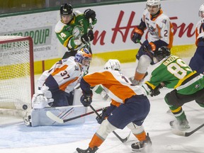 Ruslan Gazizov of the London Knights opens the scoring against the Flint Firebirds, getting a shot past goaltender Luke Cavallin in the first period in an empty Budweiser Gardens on Friday, Jan. 7, 2022. (Mike Hensen/The London Free Press)
