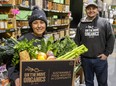 Nina Cazal, produce co-ordinator for On the Move Organics, and company founder Jeff Pastorius prepare a box of fresh produce for LifeSpin at their location in Old East Village in London. Despite a lack of government funding, LifeSpin is providing fresh produce to seniors this month and next, followed by expectant mothers the following two months. Photograph taken Wednesday, Jan. 12, 2022. (Mike Hensen/The London Free Press)